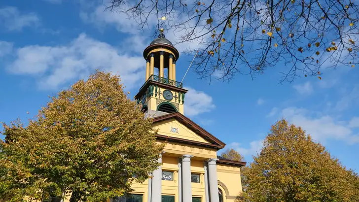 The yellow church in Sint Jacobiparochie or Sint Jabik in Friesland The Netherlands. This reformed church is a wide neoclassic church built in 1843.