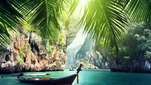 long boat and rocks on railay beach in Krabi, Thailand