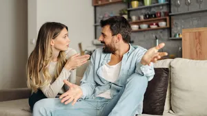 Frustrated young couple arguing at home