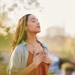 Mixed race woman relax and breathing fresh air outdoor at sunset