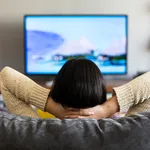 young woman watching television