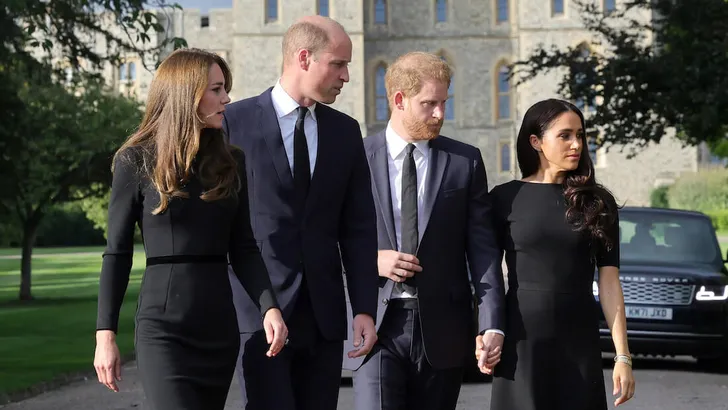 The Prince and Princess of Wales and the Duke and Duchess of Sussex viewing the messages and floral tributes