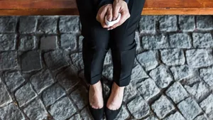 overhead view of woman holding handkerchief while sitting on bench