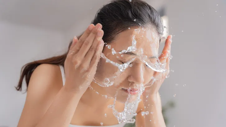 Beautiful female asian use water to wash your face Wash face.