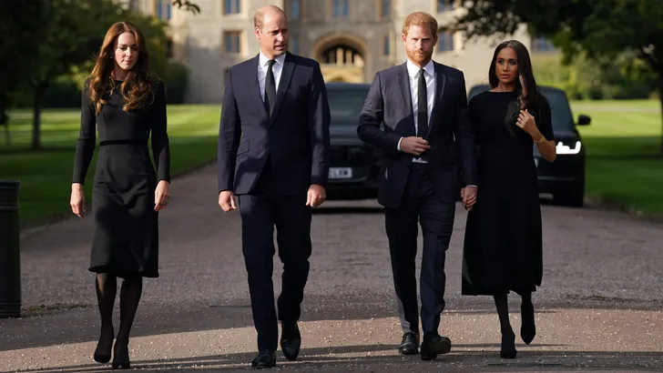 The Prince and Princess of Wales and the Duke and Duchess of Sussex viewing the messages and floral tributes