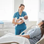 New born baby with his mother at hospital