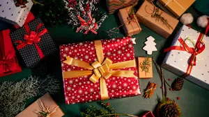 Christmas gifts and ornaments on the table at home