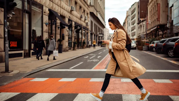 Pretty woman crossing the street