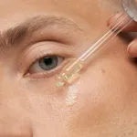 Men's skin care. Close-up facial procedure for a model. Vitamins for the restoration and renewal of the face.