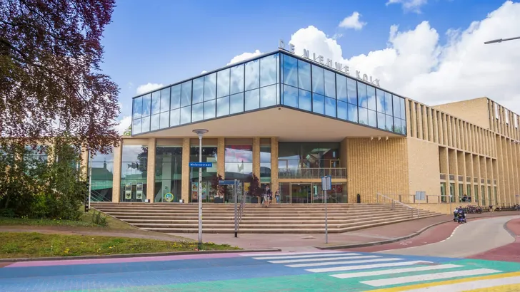 Colorful zebra crossing in front of the modern DNK building in Assen