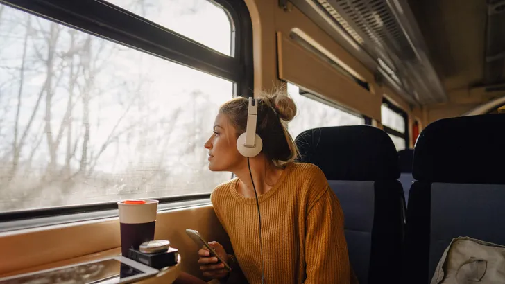 Young woman riding a train