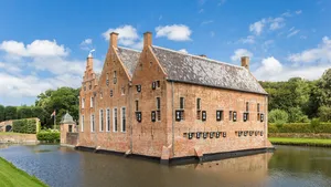 Historic Menkemaborg castle in the water in Uithuizen, Netherlands