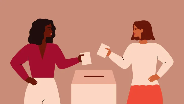 Two Strong girls are putting paper ballot in box.