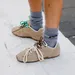 Beige sneakers van Miu Miu en grijze sokken