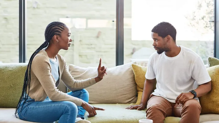 Shot of a young couple having a disagreement at home