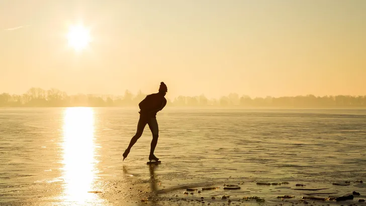 Ice skating in winter landscape