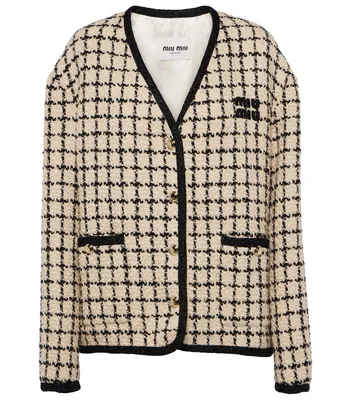 Elegantie in elke draad – dit tweed jasje is perfect voor elke gelegenheid.