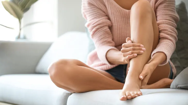 Young woman with beautiful legs at home