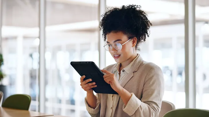 Tablet, black woman and business marketing, social media update or networking with smile. Website, company blog or online communication, office worker with glasses smile for digital strategy success