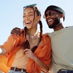 Couple, bonding and phone selfie on city building rooftop on New York summer holiday, travel vacation date or social media memory. Smile, happy or black man and woman on mobile photography technology