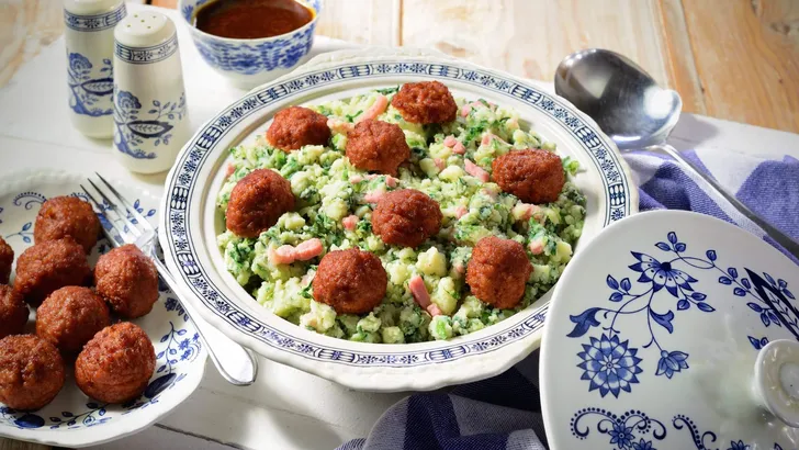 Kale and mashed potato meal with meatballs. Traditional Dutch winter meal. Stamppot.