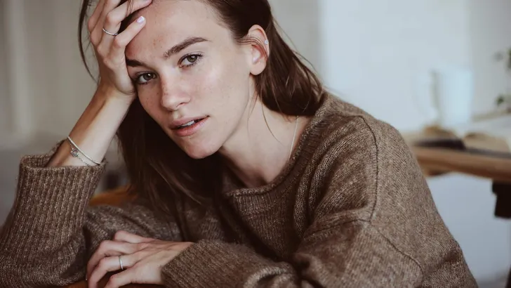 indoor portrait of beautiful feminine thoughtful young women alone in the room.